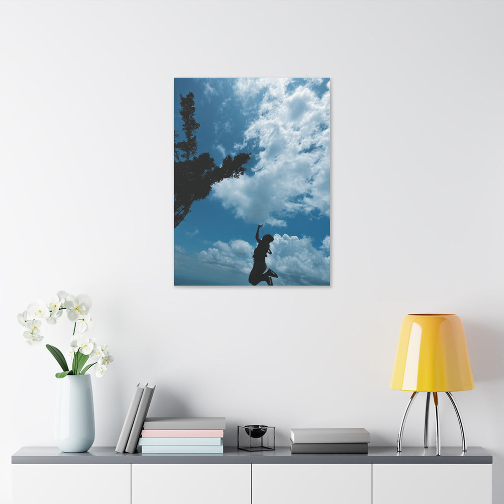 Silhouette Jumping Against Cloudy Sky - Classic Stretched Canvas