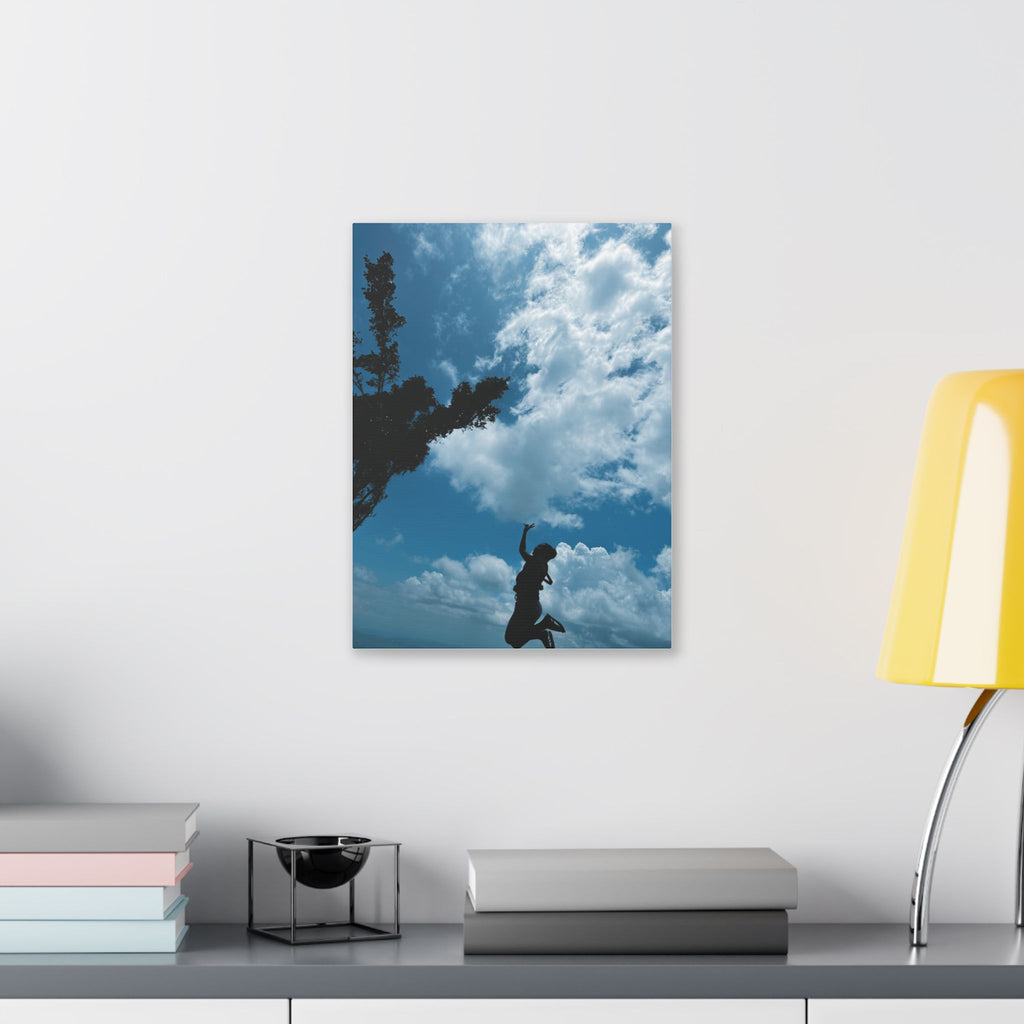 Silhouette Jumping Against Cloudy Sky - Classic Stretched Canvas